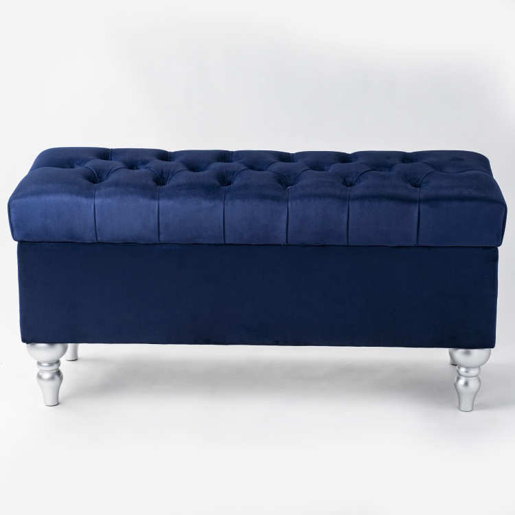 Pouf blu navy con contenitore e trapuntatura, ideale per interni moderni