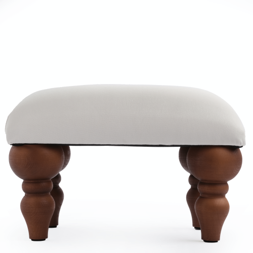 Poggiapiedi per poltrona in bianco, un elemento d'arredo pratico ed esteticamente gradevole