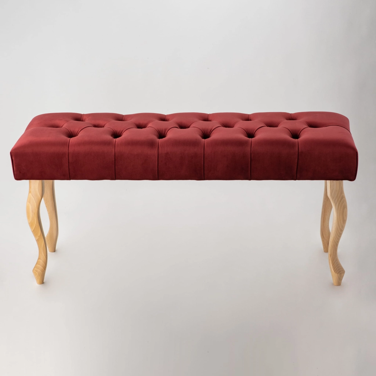 Panca imbottita bordeaux con gambe in legno