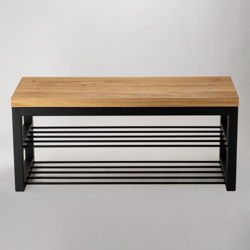 Una panca con piano in legno e base in acciaio in stile loft